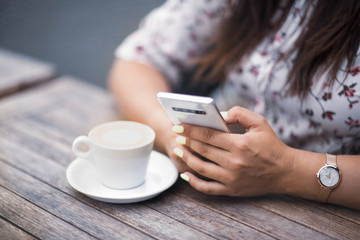 Close up of women's hands holding mobile phone with blank copy space screen for your advertising...
