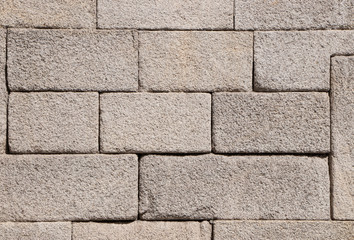 Fototapeta premium An old granite stone wall in Porto, Portugal