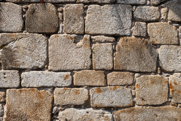 An old granite stone wall in Porto, Portugal