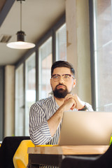 Nice good looking man thinking about his work