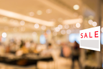 Fototapeta premium Sale signboard with Abstract blurred background of Department store interior.