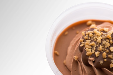 Ice cream chocolate in transparent plastic cups.