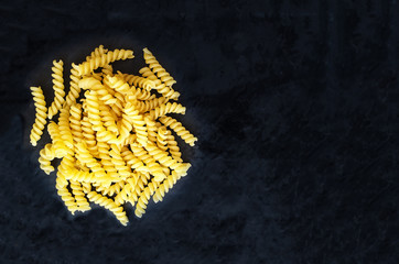 Raw rotini or fusilli screw-like pasta
