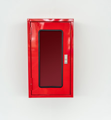 Empty red metal box hanging on white background.