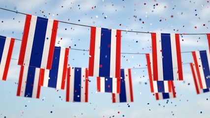 Thai flags in the sky with confetti.