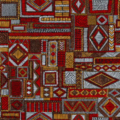 Seamless pattern in patchwork style. Embroidered print for carpet, textile, wallpaper, wrapping paper. Ethnic and tribal motifs. Handwork. Vector illustration.