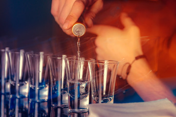 Shots for vodka in a nightclub. Dark party photo