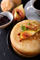 Food concept Homemade organic pancakes stack with fig breakfast on black background