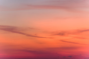 sunset background. sky with soft and blur pastel colored clouds. sunshine through the gradient cloud on the beach resort. nature. sunrise.  peaceful morning