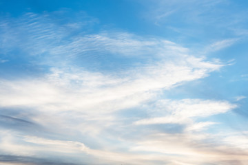 sunset background. sky with soft and blur pastel colored clouds. sunshine through the gradient cloud on the beach resort. nature. sunrise.  peaceful morning