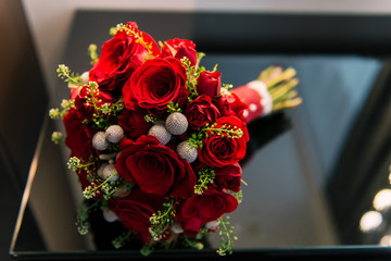 Wedding accessories bride and groom. Wedding bouquet, groom’s boutonniere, rings, floristry and decorations