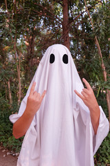 girl dressed in ghost costume with funny expression