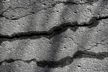 asphalt in cracks texture / abstract background cracks on asphalt road