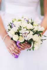 Obraz na płótnie Canvas Wedding bouquet in the hands of the bride close-up. Wedding flowers.