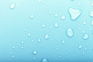 Drops of water on a color background. Selective focus. Blue. Toned