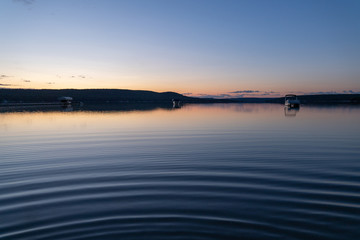 Sunrise on calm Little Glen Lake in Glen Arbor Michigan