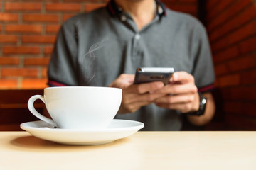 The man use smartphone in coffee shop