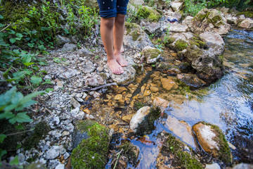 Children adventure at forest creek in nature