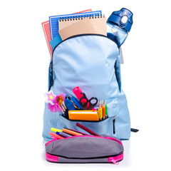 Blue backpack with school supplies on white background isolation