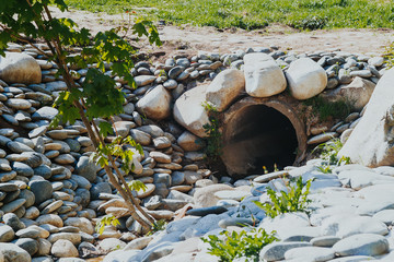 drain pipe or effluent or sewer release wastewater into river. Sewage or domestic wastewater or...