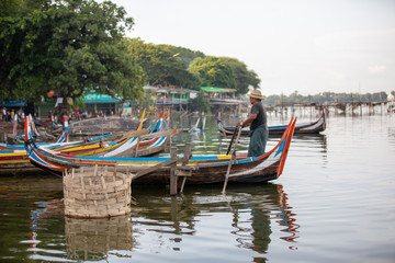 Obraz premium MANDALAY/MYANMAR(BURMA) - 30th July, 2019 : U BEIN BRIDGE is one of the famous teakwood bridge in the world. Located in Mandalay, Myanmar.