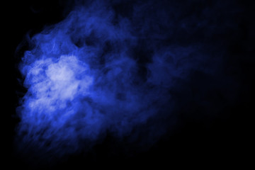 Jet of smoke on black background. Selective focus. Toned