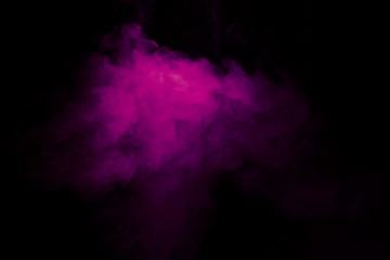 Obraz na płótnie Canvas Jet of smoke on black background. Selective focus. Toned