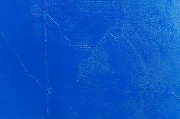 texture of rough wall painted in bright blue