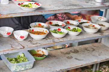 Various thai food on shelving for donation.