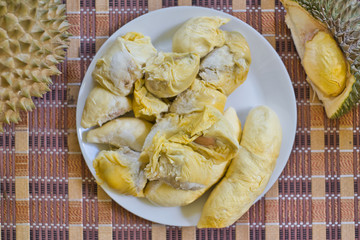 Delicious  peeled yellow durian in dish. Durian is Thai exotic fruit and the king of Thai fruit.