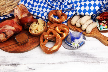 Traditional German cuisine, Schweinshaxe roasted ham hock. Beer, pretzels and various Bavarian specialties. Oktoberfest background