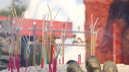 Video 4k of close-up Incense sticks burning with smoke