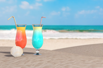 Summer Vacation Concept. Red and Blue Tropical Cocktails with Beauty Scallop Sea or Ocean Shell Seashell on an Ocean Deserted Coast. 3d Rendering