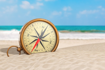 Glossy Bronze Vintage Compass with Windrose on an Ocean Deserted Coast. 3d Rendering © doomu