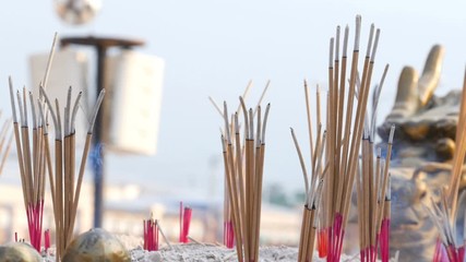 Video 4k of close-up Incense sticks burning with smoke