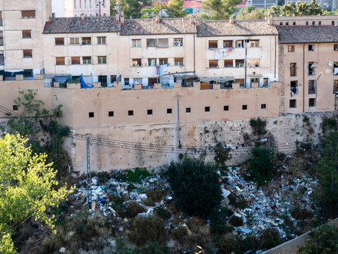 dirt and trash next to apartment building