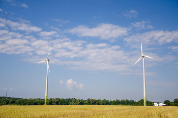 Wind turbine farm power generator .in field.