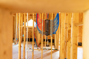 PEX plumbing manifold for water distribution in new home construction. Selective focus