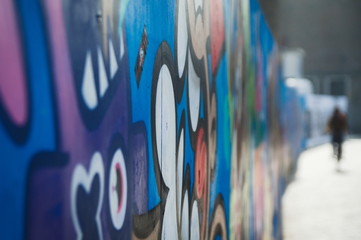 Graffiti on the wall in the city with shallow depth of field blurry background