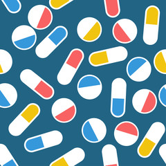 White pills and tablets on dark blue background, seamless pattern.