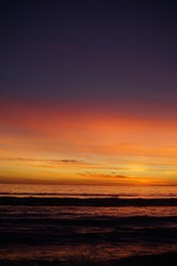 VIBRANT SUNSET WITH SURFERS SPORTS