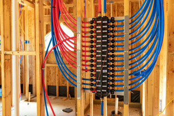 PEX plumbing manifold for water distribution in new home construction