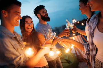 Friends having party on top of the roof. Fun, summer, city lifestyle and friendship concept