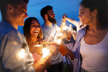 Group of young happy friends having party and fun