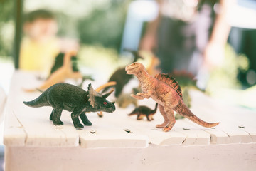 toy dinosaur on table,