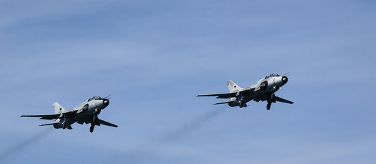A PAIR ATTACK AIRCRAFT - Polish Air Force aircraft in flight against the blue sky