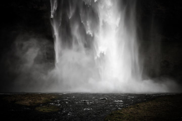 Famous Iceland waterfalls with a clean water on a stony rocky mountain landscape. Toned