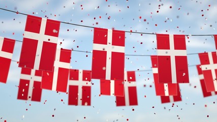 Denmark flags in the sky with confetti.