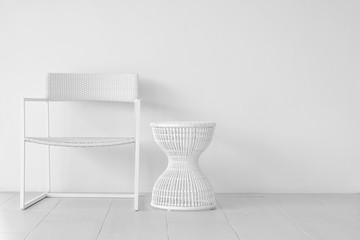 Elegant white chair in an empty room with tile floor.
