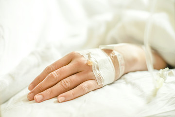 Close up of a woman patient in hospital with saline intravenous